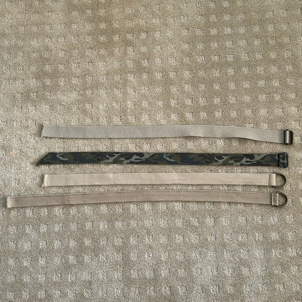 Lot of four belts.  Khaki and camouflage
